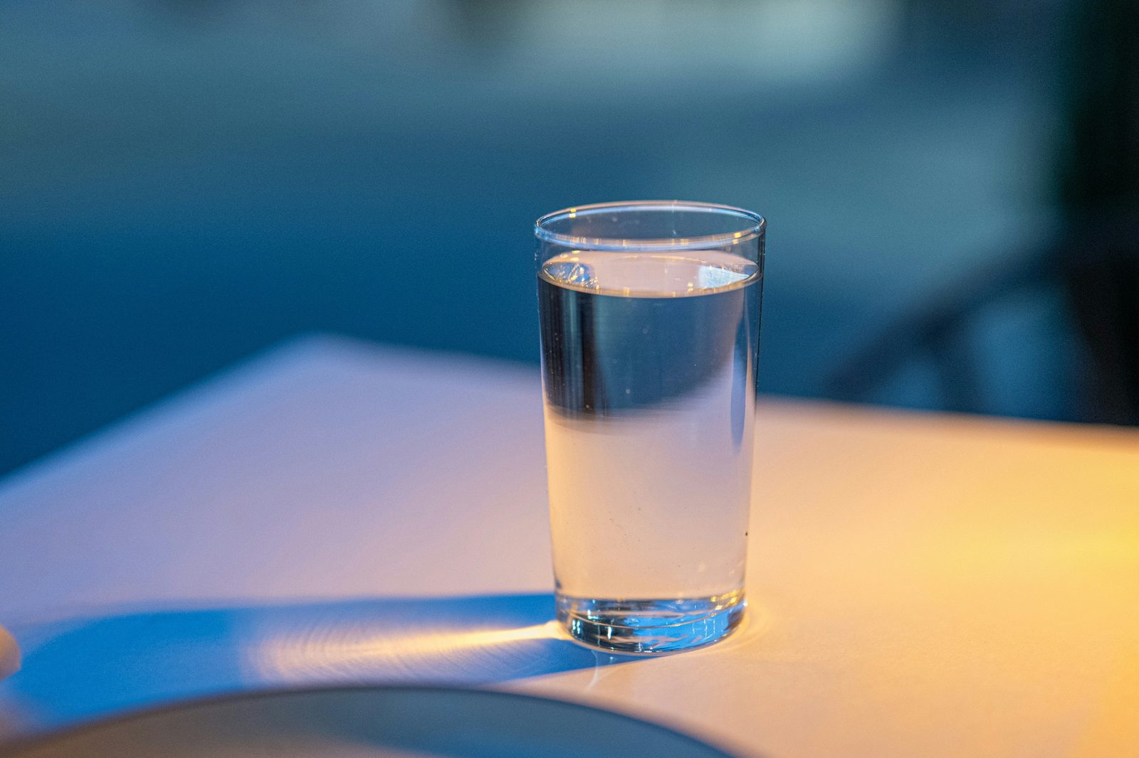 Glass of water representing hydration's role in metabolism