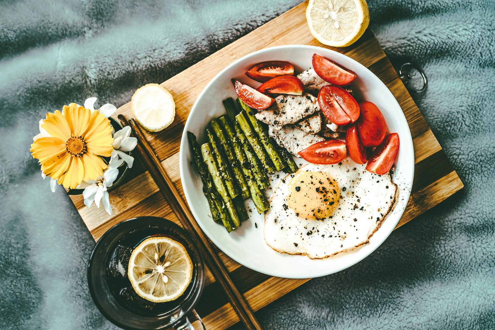 Plate with eggs, chicken, and asparagus, representing keto and carnivore diet foods