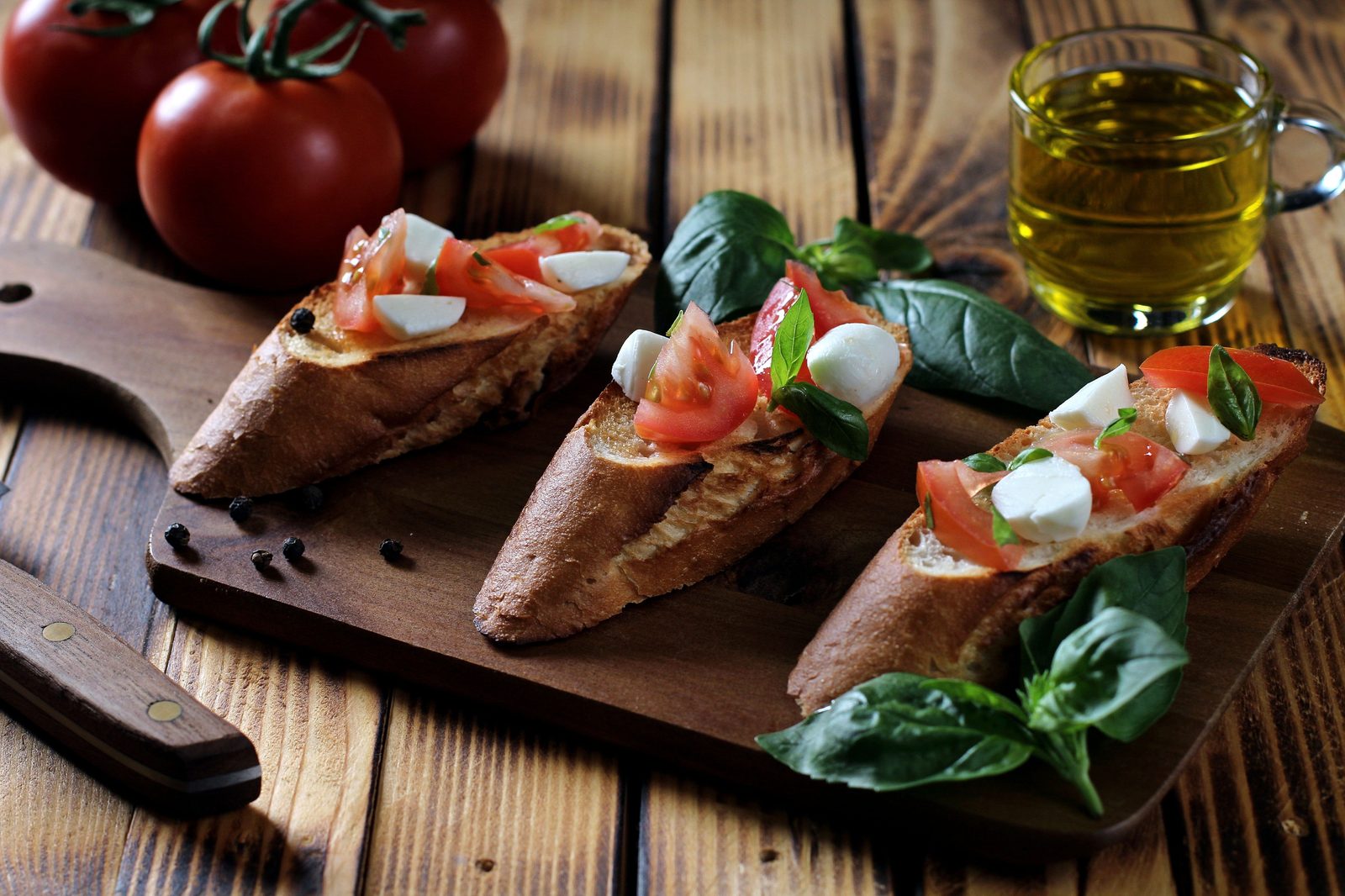 Mediterranean diet bruschetta with tomato, mozzarella, basil, and olive oil