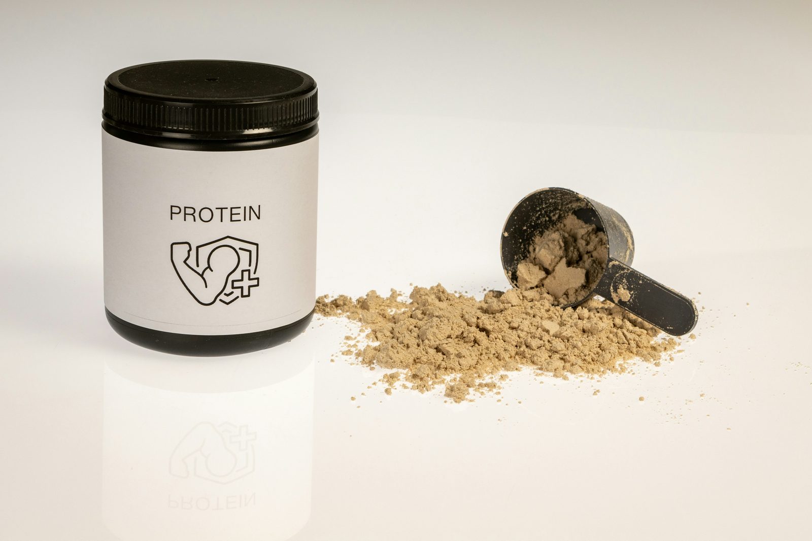 Whey and casein protein powder in a jar with a scoop, comparing the two protein types
